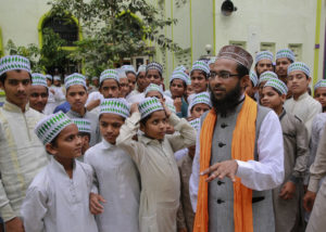 Indian Muslim cleric Mohammed Manzar Hasan Ashrafi Misbahi, right speaks with Islamic students at the Ajmeri Masjid in Mumbai, India, Wednesday, Sept. 9, 2015. More than 1,000 Muslim clerics in India have ratified a religious ruling that condemns the Islamic State and calls the extremist group's actions "un-Islamic, Misbahi said Wednesday.(AP Photo/Rafiq Maqbool)